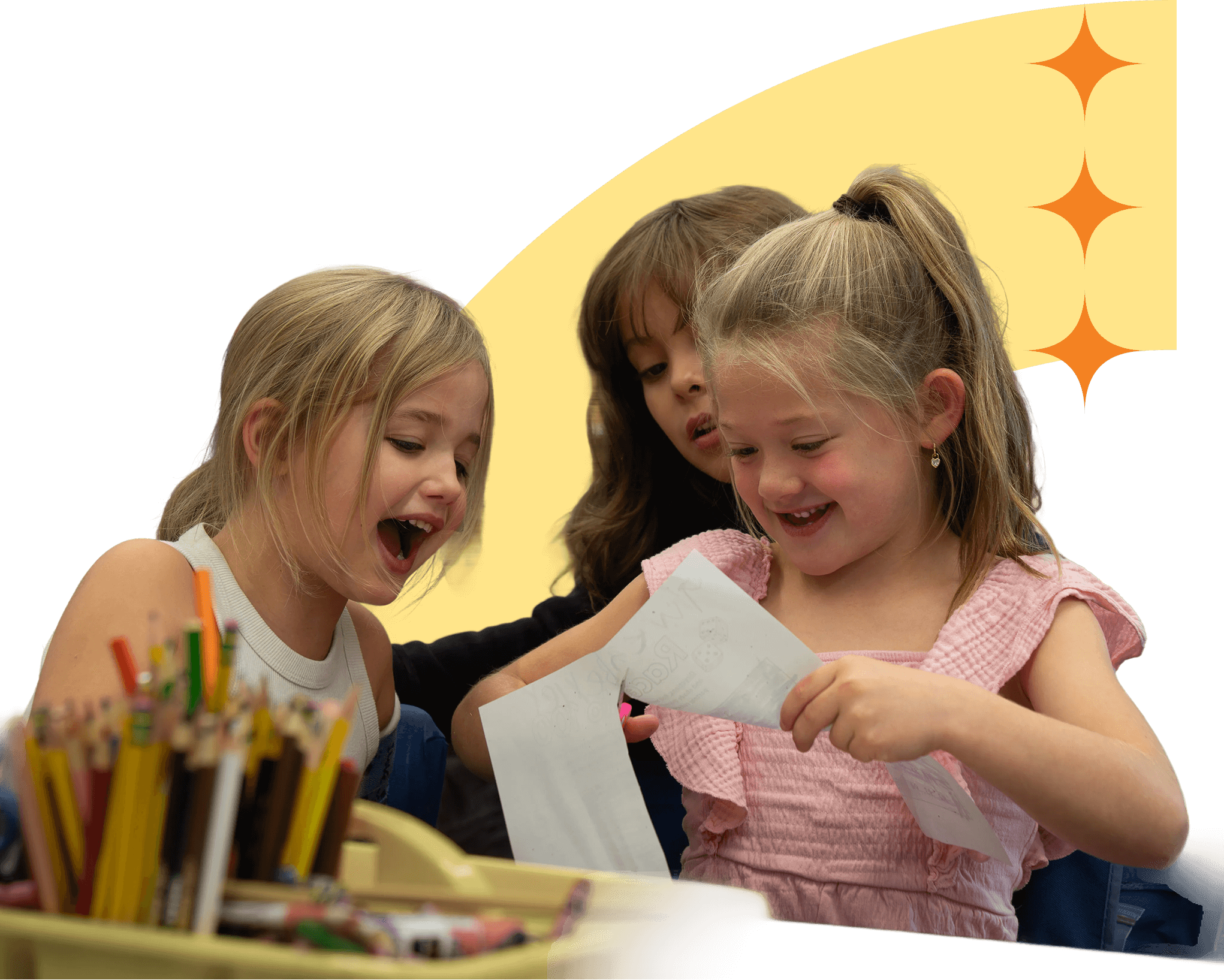 Students in the BARR program working on a project and smiling at school.